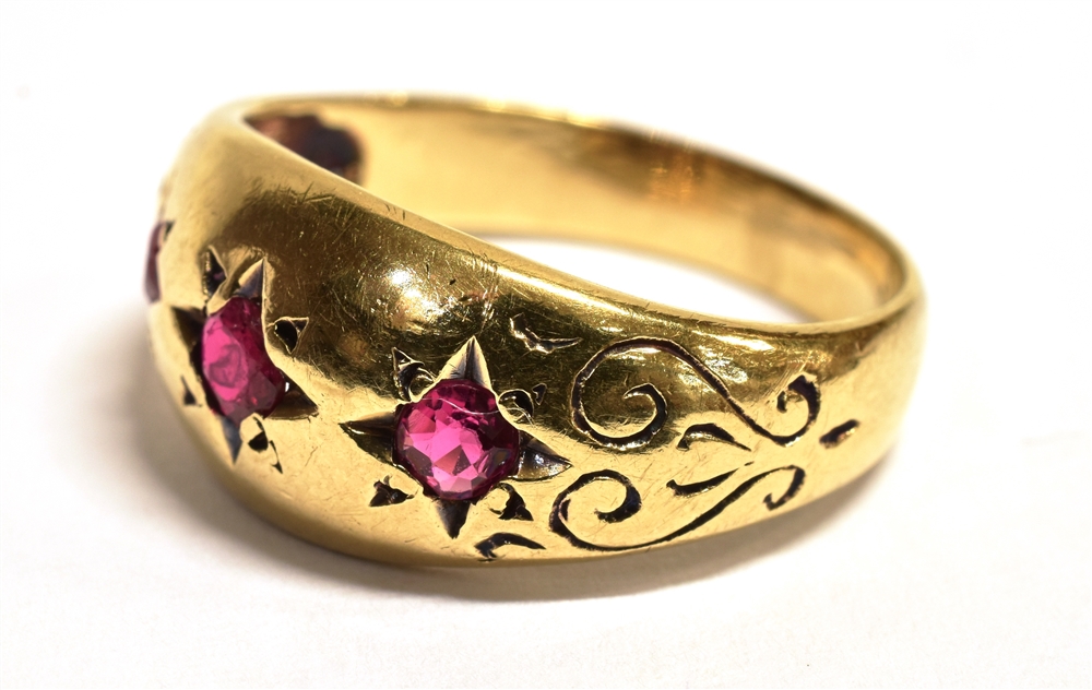 A 9CT GOLD RUBY GYPSY RING The ring set with three star set rubies, engraved pattern to the - Bild 3 aus 3