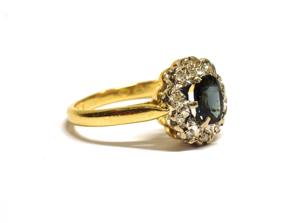 18CT GOLD SAPPHIRE CLUSTER RING The cluster measuring 1.1 x 0.9cm and set with a central oval blue - Image 2 of 4