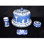 A WEDGWOOD BLUE GROUND JASPERWARE STILTON DISH AND COVER with sprigged decoration of a Classical