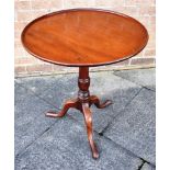 A 19TH CENTURY MAHOGANY TILT TOP TRIPOD TABLE the circular tray top, 61cm diameter Condition