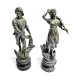 A PAIR OF FRENCH SPELTER FIGURES modelled as peasants, on turned wooden bases, 38cm hig overall
