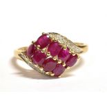 QVC 9CT GOLD RUBY WRAP OVER CLUSTER RING The cluster with white metal and flecked clear stone
