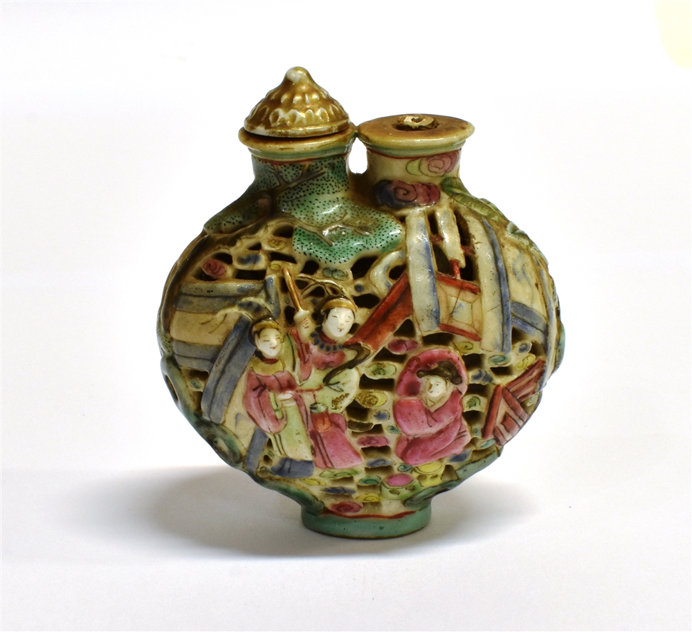 A CHINESE DOUBLE SNUFF BOTTLE the reticulated body decorated with figures and buildings and