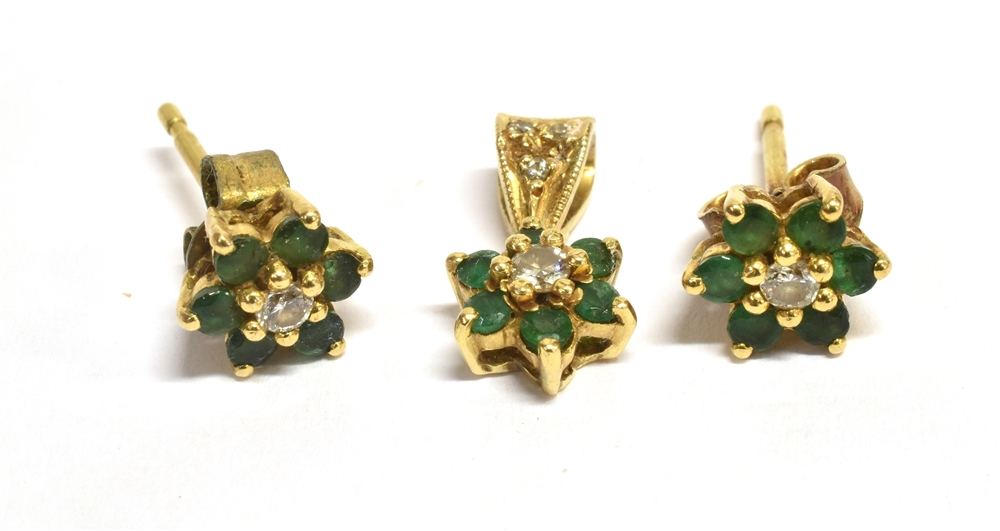 DIAMOND AND GREEN STONE FLOWER HEAD PENDANT AND MATCHING EARRINGS The pendant and earrings set