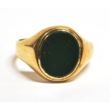 A GREEN BLOODSTONE SIGNET RING The shank with worn markings assessed as 9ct gold, ring size X,