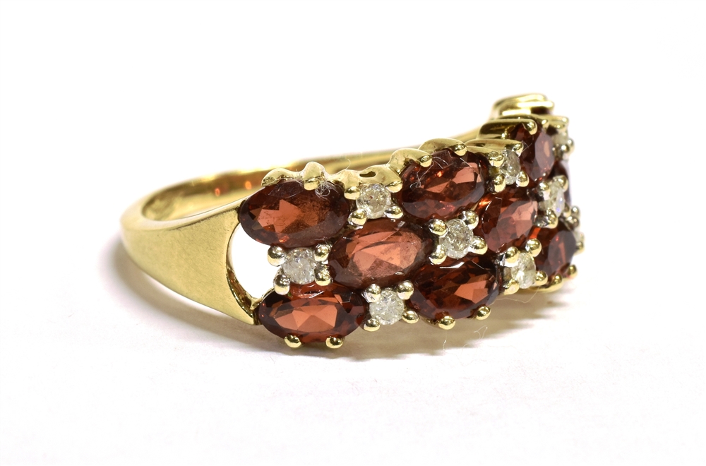 A 9CT GOLD DIAMOND AND SPESSARITE MIXED CUT CLUSTER RING The ring set with a triple band of - Image 2 of 3