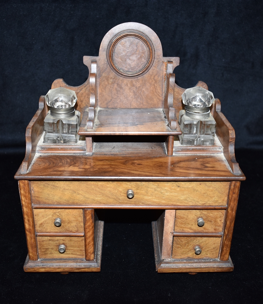 A VICTORIAN OLIVEWOOD 'APPRENTICE PIECE' DESK STAND fitted with two inkwells, 24cm wide Condition