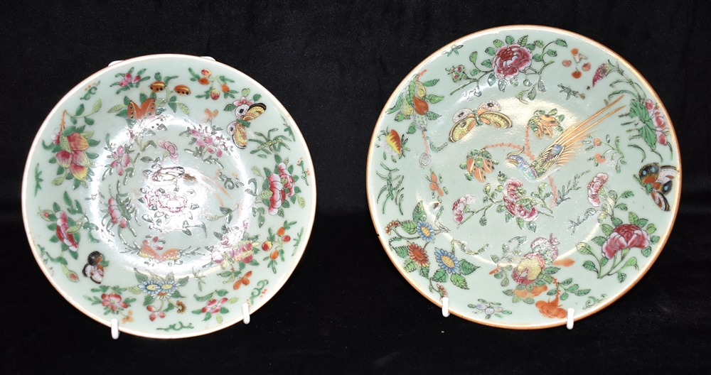 TWO CHINESE PLATES decorated with birds, butterflies and blossoming branches on a celadon ground,