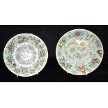 TWO CHINESE PLATES decorated with birds, butterflies and blossoming branches on a celadon ground,