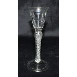 AN 18TH CENTURY WINE GLASS with air twist baluster stem, on conical folded foot, 18.5cm high
