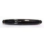 AN OLIVE BLACK GLASS ROLLING PIN probably Nailsea, with decorative white flecks, 38cm long.