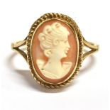 A CAMEO RING The ring set in unmarked yellow metal with the cameo measuring 1.7 x 1.4 cm Ring size