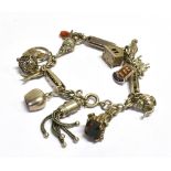 A SILVER AND WHITE METAL CHARM BRACELET Weight 45.5g approx.