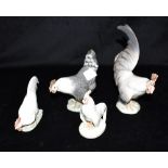 TWO PAIRS OF ROYAL COPENHAGEN FIGURES OF CHICKENS: models 1024 and 1025, 1126 and 1127 all