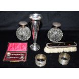 A COLLECTION OF SILVER Weighted silver candlestick, height 16.5cm, two silver topped cut glass