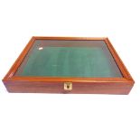 A MAHOGANY TABLE TOP DISPLAY CABINET with a hinged lid, overall 9cm high, 61cm wide, 46cm deep.