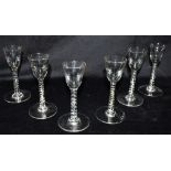 A SET OF SIX WINE GLASSES with spiral turned stems, 13cm high Condition Report : all in good