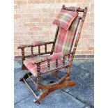 A RE-UPHOLSTERED STAINED BEECH BOSTON ROCKING ARMCHAIR Condition Report : signs of age, but no