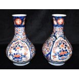 A PAIR OF JAPANESE IMARI VASES with foliate painted decoration, 24.5cm high Condition Report : one