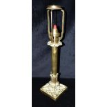 A VICTORIAN BRASS SPRING LOADED CANDLE LAMP stamped 'PALMER & CO PATENT', wiht foliate cast base,