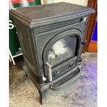 A CAST IRON WOODBURNING STOVE Condition Report : apparently unused. no signs of a maker or model