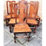 A HARLEQUIN SET (4 +2) OF SIX PROVINCIAL OAK DINING CHAIRS with vase shaped splats, solid seats