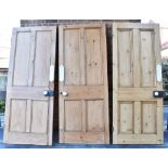 THREE VICTORIAN RECLAIMED PINE INTERNAL DOORS of four panelled construction, each with original