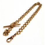 A STAMPED 9.375 WATCH CHAIN AND T-BAR The chain of Rose metal fancy curb links, each stamped 9.375