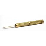 A 9CT GOLD CASED RETRACTABLE TOOTHPICK The case in machine turned pattern, hallmarked for Birmingham