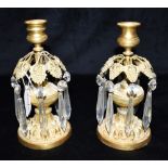 A PAIR OF 19TH CENTURY FRENCH GILT METAL CANDLESTICKS with glass drops, 21cm high Condition Report :