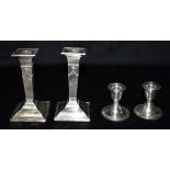 TWO PAIRS OF SILVER CANDLESTICKS Matched pair of silver Edwardian candle sticks, hallmarked for