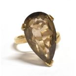 VINTAGE 9CT GOLD SMOKY QUARTZ COCKTAIL RING The pear cut stone measuring 2.2cm X 1cm at mid point