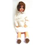 A GERMAN BISQUE SOCKET HEAD DOLL with a brown wig, sleeping grey glass eyes, and an open mouth