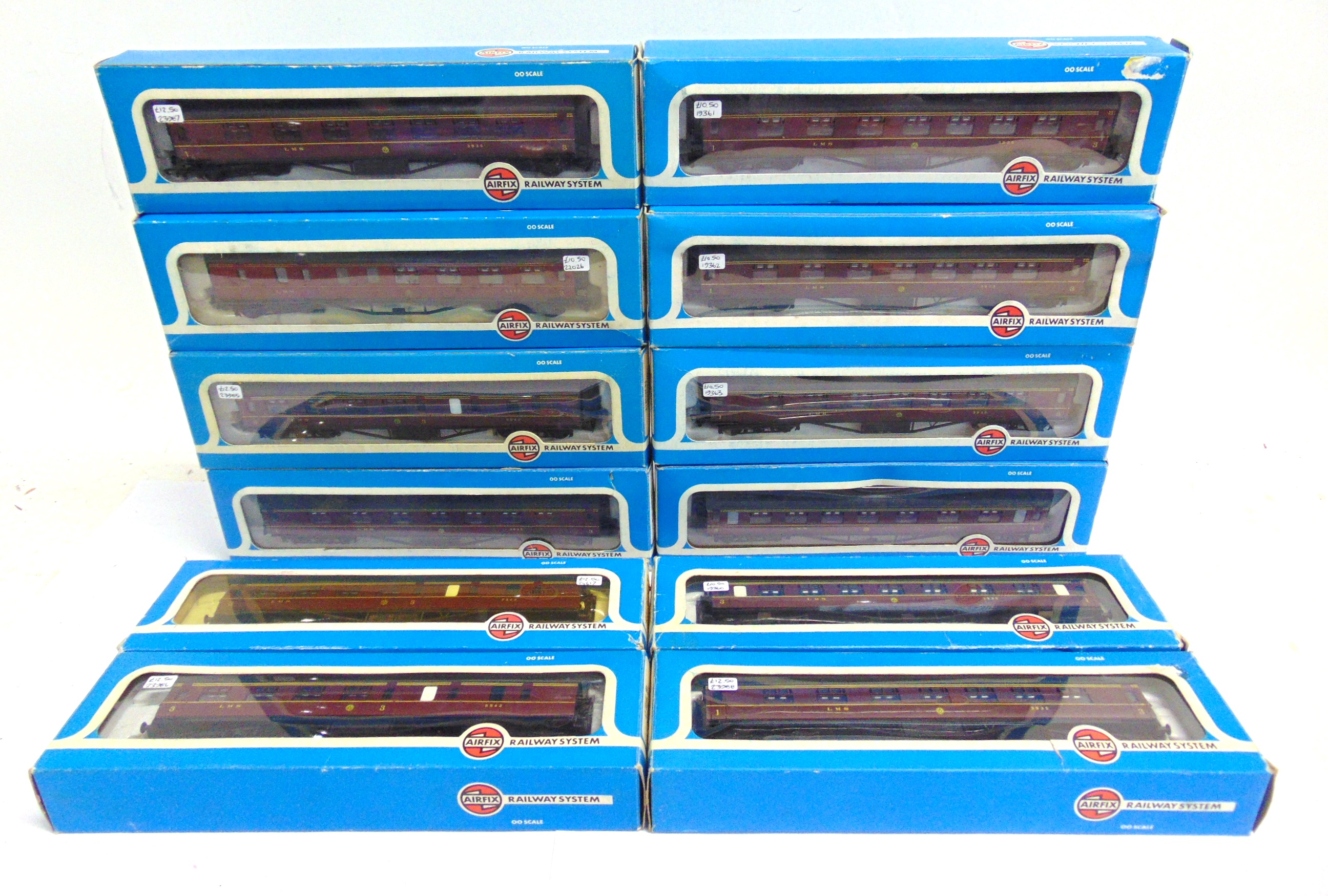 [OO GAUGE]. TWELVE AIRFIX L.M.S. CORRIDOR COACHES all in lined maroon livery, each boxed.