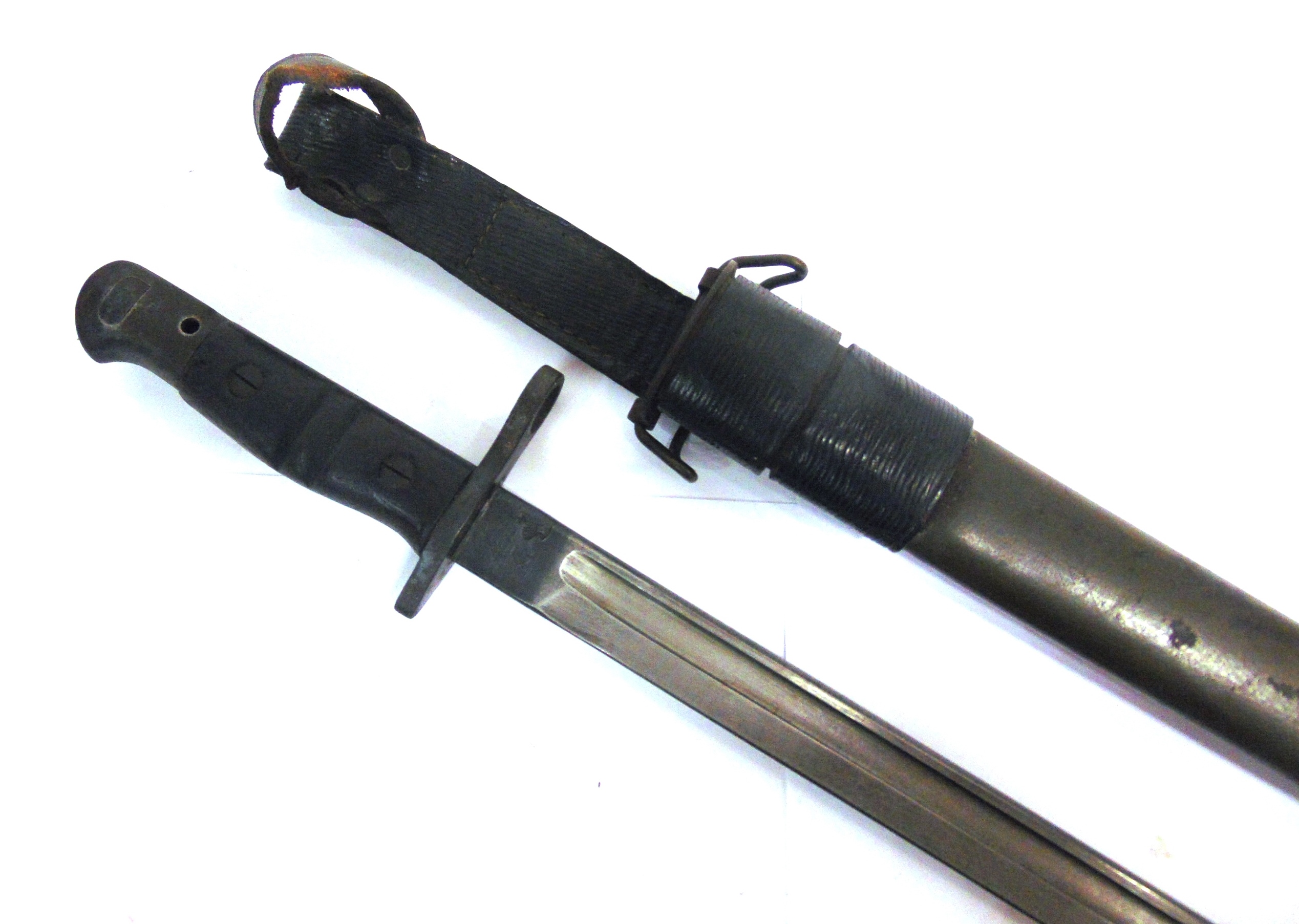 A U.S. M1917 SWORD BAYONET by Remington, the 17 inch (43cm) blade marked at the ricasso '1917 /