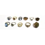 ELEVEN VINTAGE RINGS The rings in unmarked metals, one marked 9ct sil (gold plated) stones include