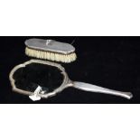 A SILVER BACKED MIRROR AND CLOTHES BRUSH Worn hallmarks, condition reasonable