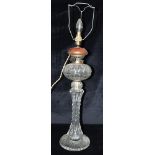 AN EDWARDIAN GLASS OIL LAMP converted to electricity, 55cm high excluding electrical fitting