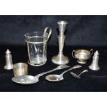 COLLECTION OF SILVER to include a salt and pepper pot, a napkin ring, a weighted candlestick etc,