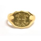 18CT GOLD SIGNET RING The ring set with a monogrammed bezel, hallmarked for Birmingham (worn date