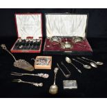 A COLLECTION OF SILVER AND SILVER PLATE To include four silver Apostle tea spoons, silver sugar nips
