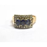 STAMPED 14K DIAMOND AND SAPPHIRE CLUSTER RING The horizontally set rectangular cluster set in