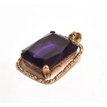 PURPLE SAPPHIRE PENDANT PIECE The step cut sapphire measuring 2.2 x 1.7cm in an unmarked mount