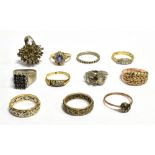 11 ASSORTED RINGS In various styles and sizes, in marked and unmarked yellow and white metal to