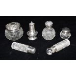 ASSORTED SILVER AND GLASSWARE A silver pepperette, four silver topped cut glass jars/bottles various