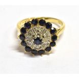 18CT GOLD GEM SET TARGET RING The ring set with a blue and clear Quartz central target, Bombe