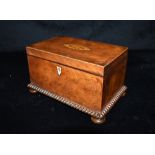 A VICTORIAN MAHOGANY TWIN COMPARTMENT TEA CADDY with marquetry inlaid decoration, 21cm wide