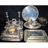 A COLLECTION OF SILVER PLATE comprising tureens, a pair of candlesticks etc