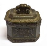 A LEAD TOBACCO BOX AND COVER of canted rectangular form, with relief moulded decoration, 10cm wide