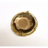 LARGE SMOKY QUARTZ PENDANT PIECE The faceted round cut single stone measuring 3.6cm in diameter